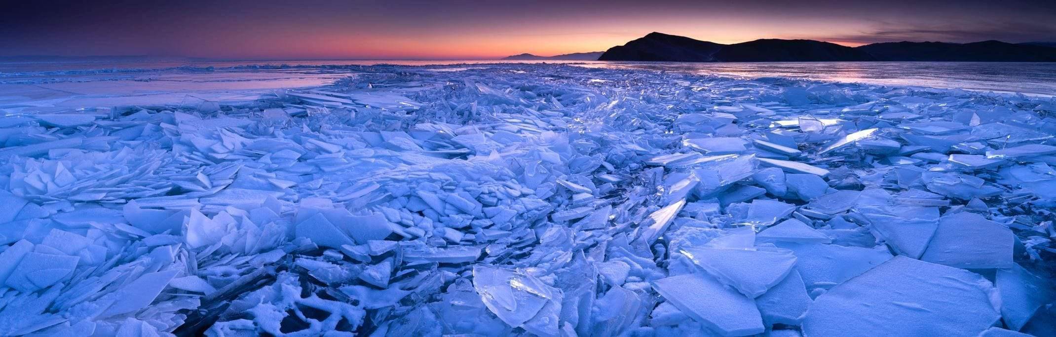 A landscape view presenting thousands of broken ice pieces depicting like a giant broken wall of glassy snow, Baikal Ice - Russia 