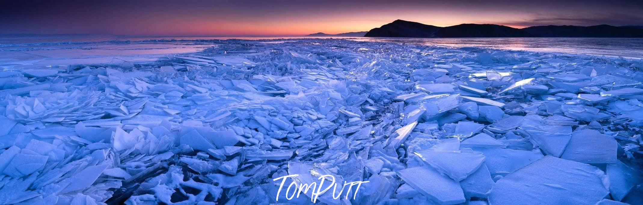 A landscape view presenting thousands of broken ice pieces depicting like a giant broken wall of glassy snow, Baikal Ice - Russia