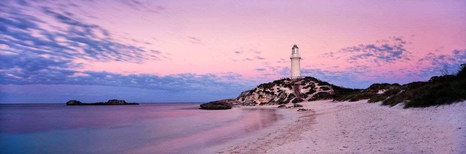 A beautiful landscape of a tower built on the mount near the seashore, and a purplish effect of weather on the scene, Bathurst Lighthouse - Rottnest Island WA