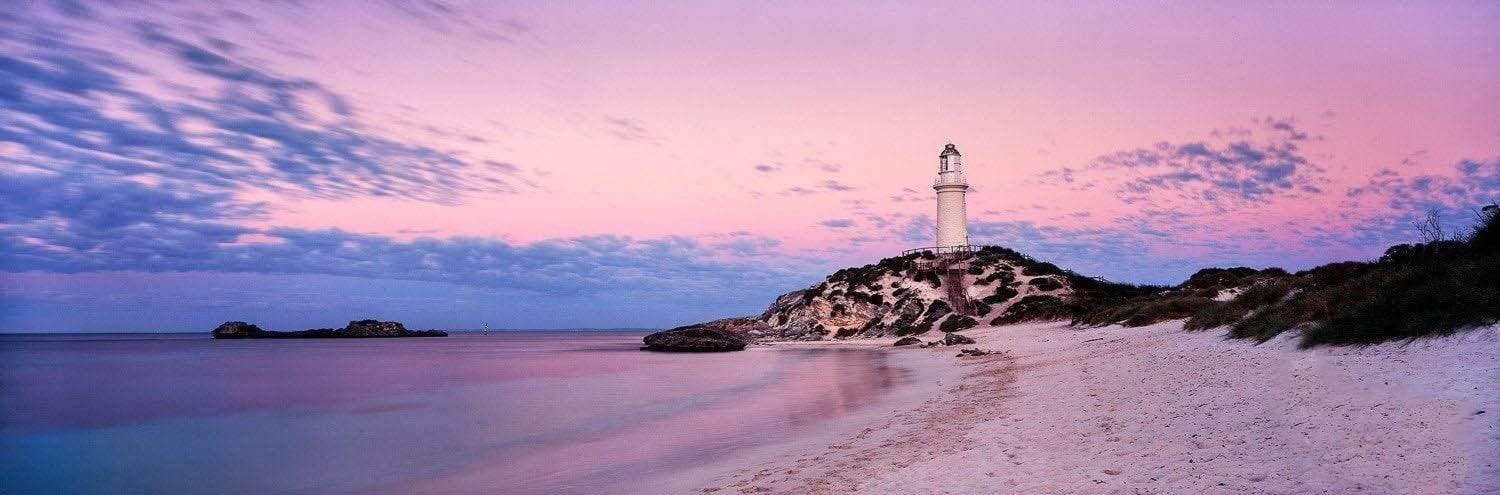 A beautiful landscape of a tower built on the mount near the seashore, and a purplish effect of weather on the scene, Bathurst Lighthouse - Rottnest Island WA