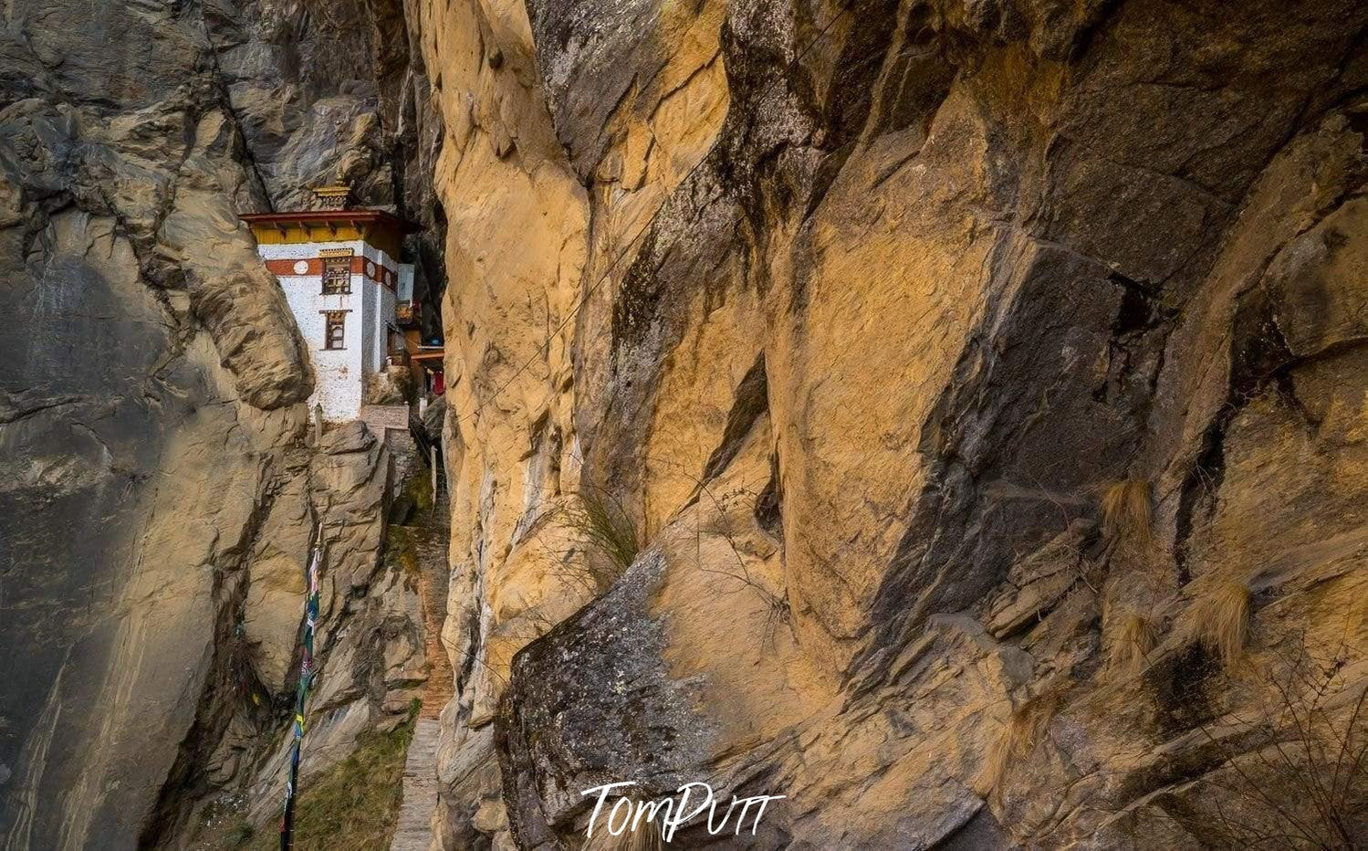 A prayer place between the walls of a high mountain, Bhutan Temple