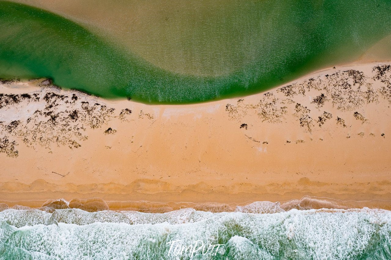 Aerial view of the green sea corner connecting with a land, and some snow-covered stones, Broome No.2