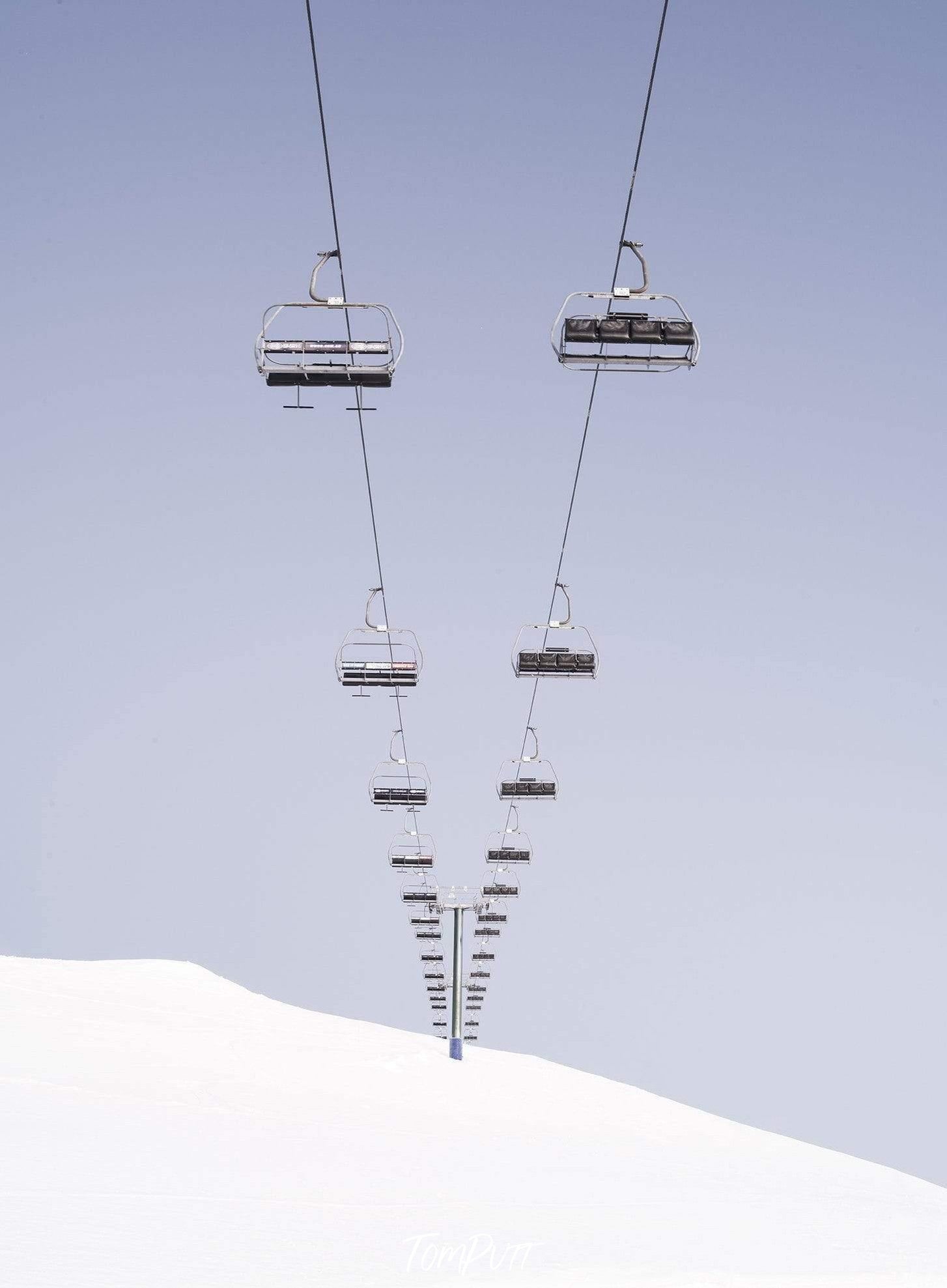 a beautiful view of a chairlifts series above the land fully covered with the fresh snow, Chairlift Mt Hotham, Victoria