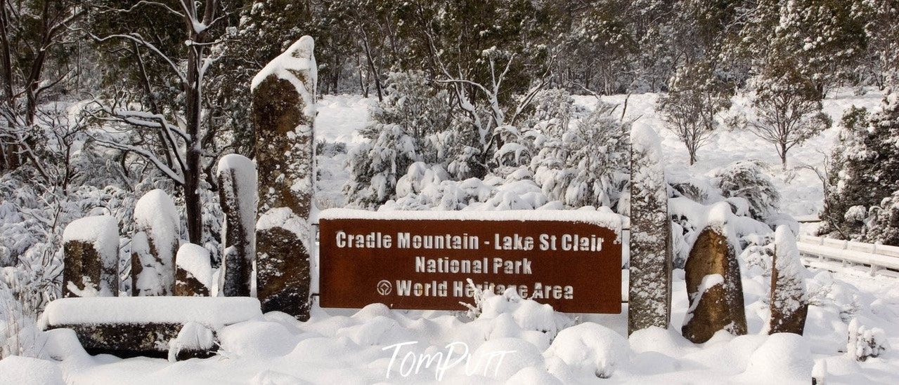A snow-covered area with an address written on a wood plate, Cradle Mountain #2, Tasmania