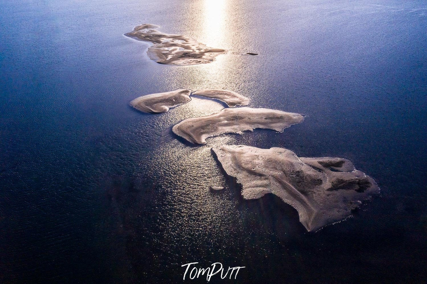 Aerial view of small sand islands in the sea with a line of sunlight effect, French Island Aerial #6 - Western Port Bay