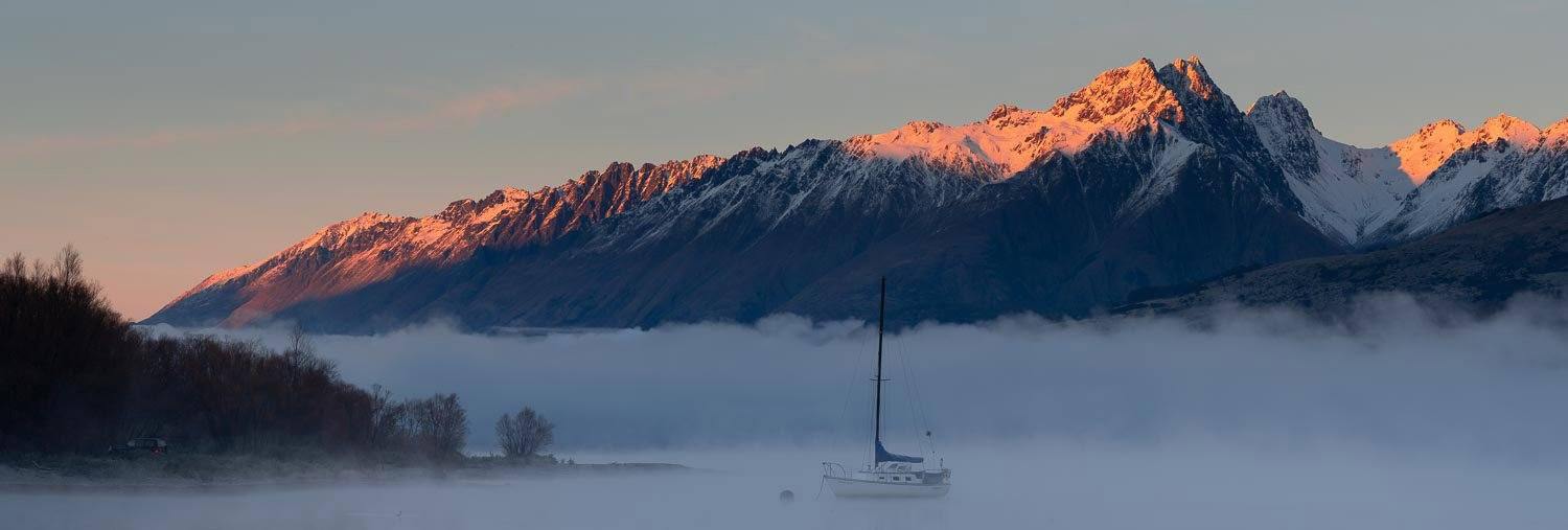 Area fully covered with snow a long mountain walls in the background, Glenorchy Mist - New Zealand