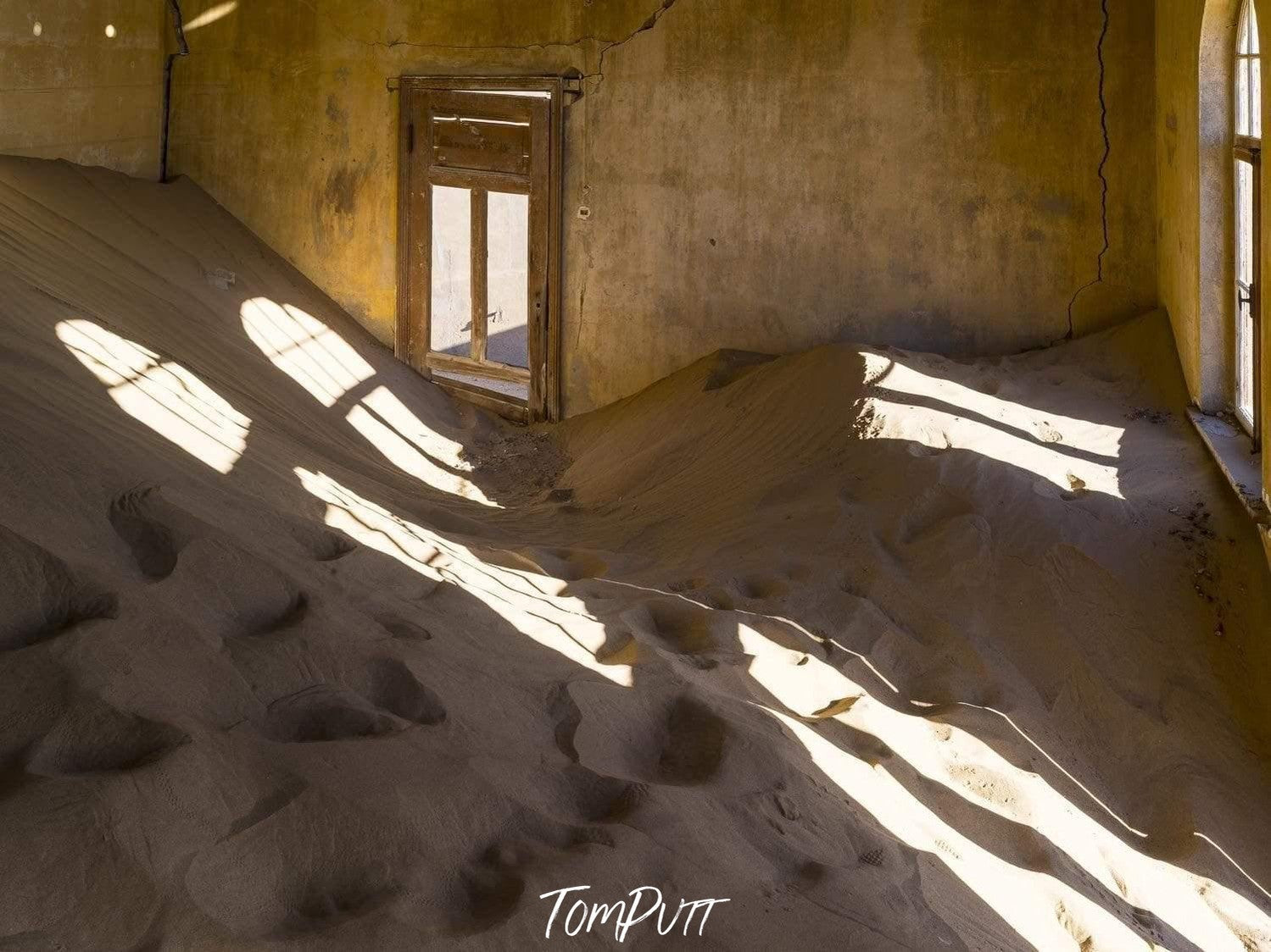 Empty room full of sand and a little sunlight coming, Kolmanskop No.13