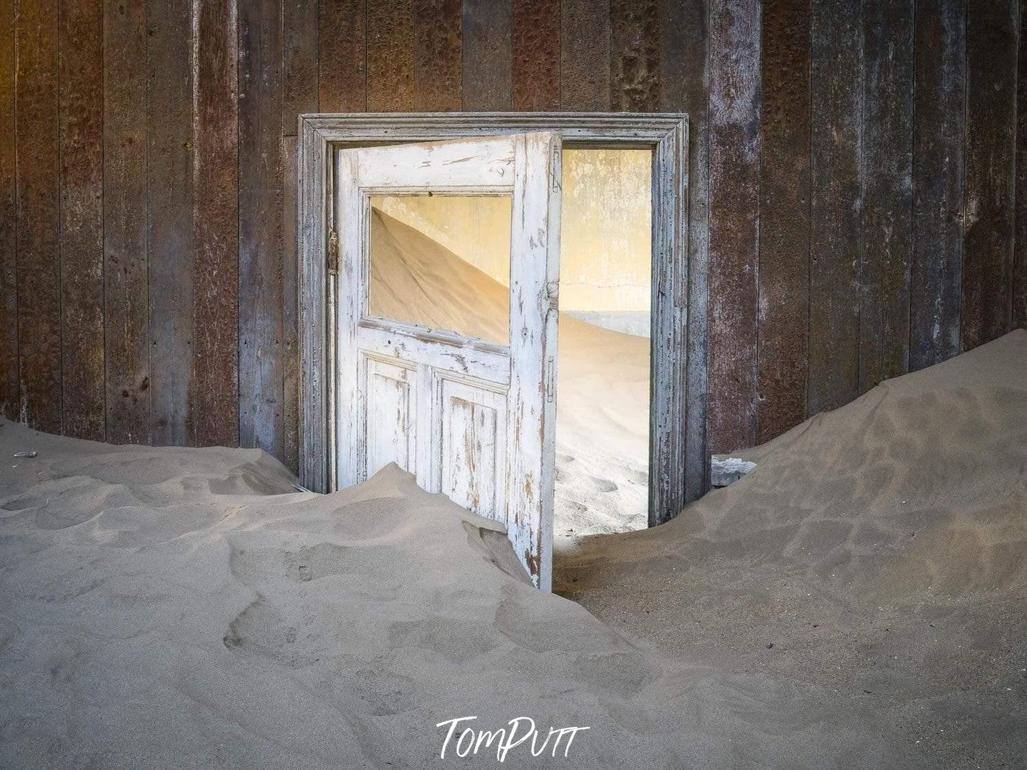 Making of a housing room with open door and a lot of construction sand, Kolmanskop No.34
