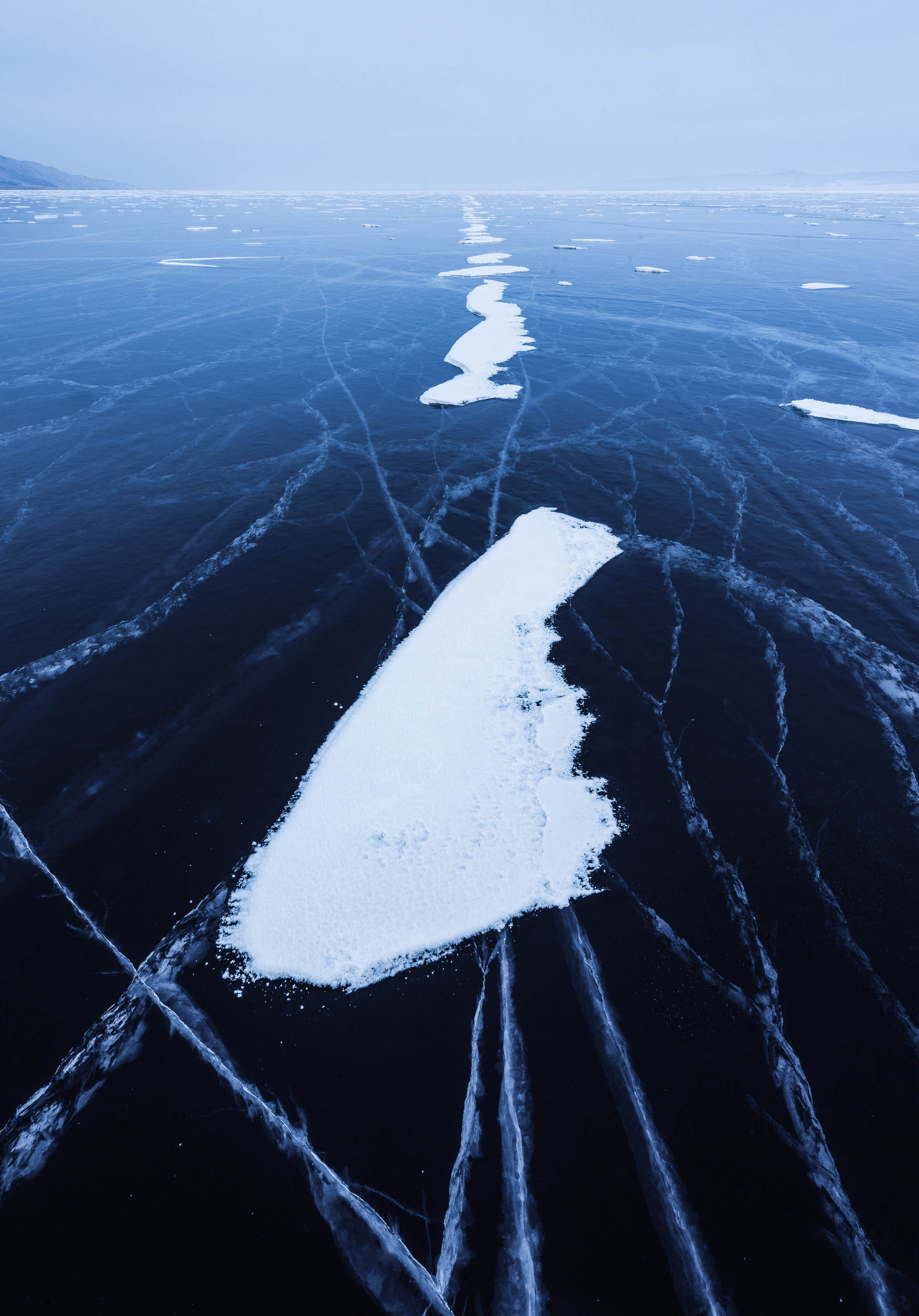 A frozen lake with some fresh snow, Lake Baikal #35, Siberia, Russia
