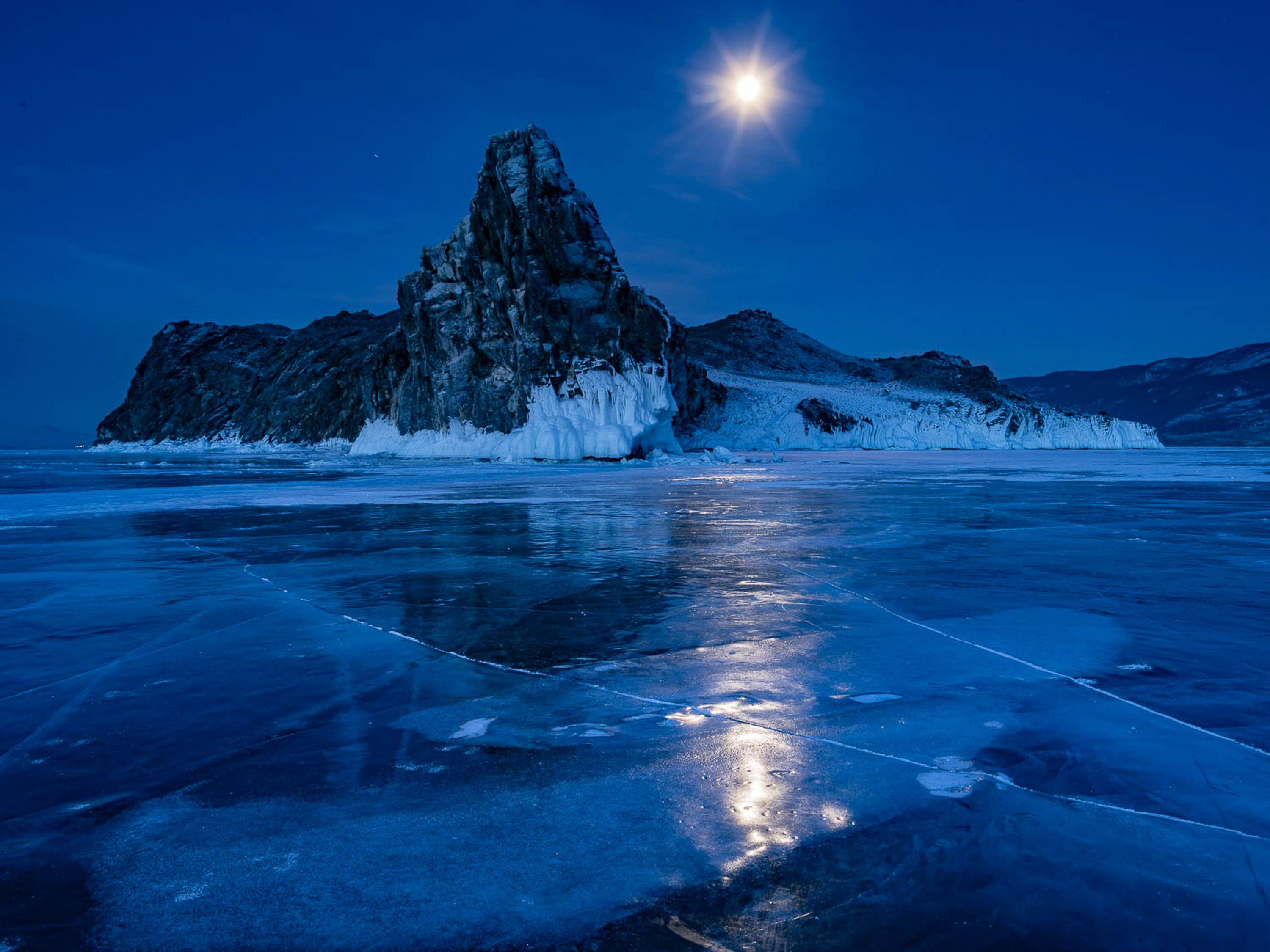 Frozen lake with a great black mountain, and a shining moon besides, Lake Baikal #51, Siberia, Russia