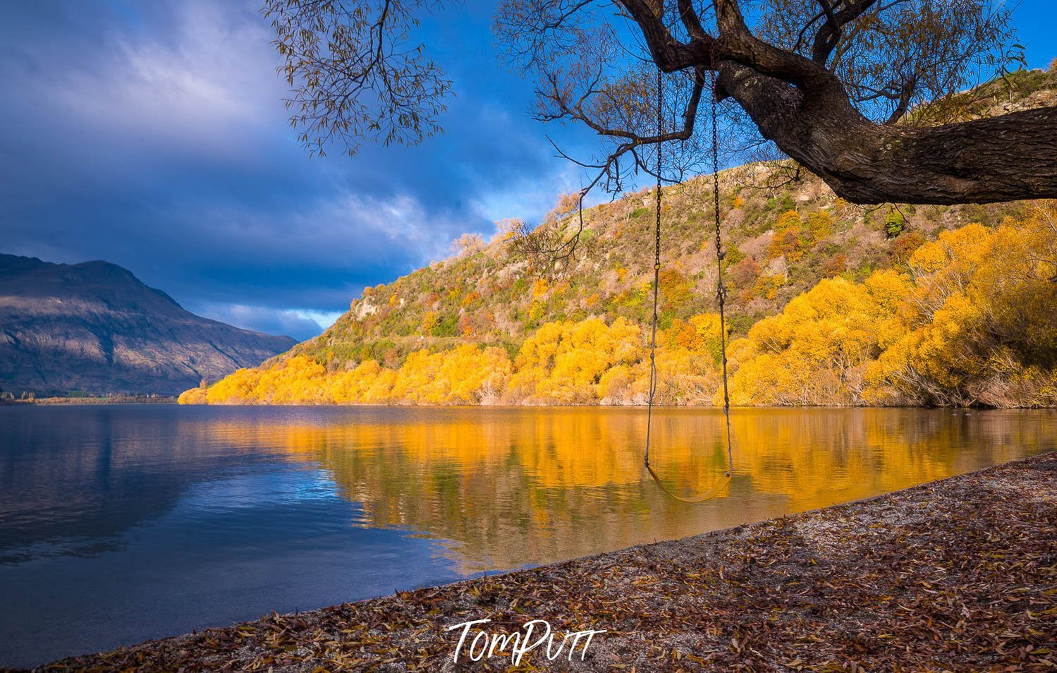 A beautiful yellow and green colored mountain with a lake below, and a ahead, New Zealand #23