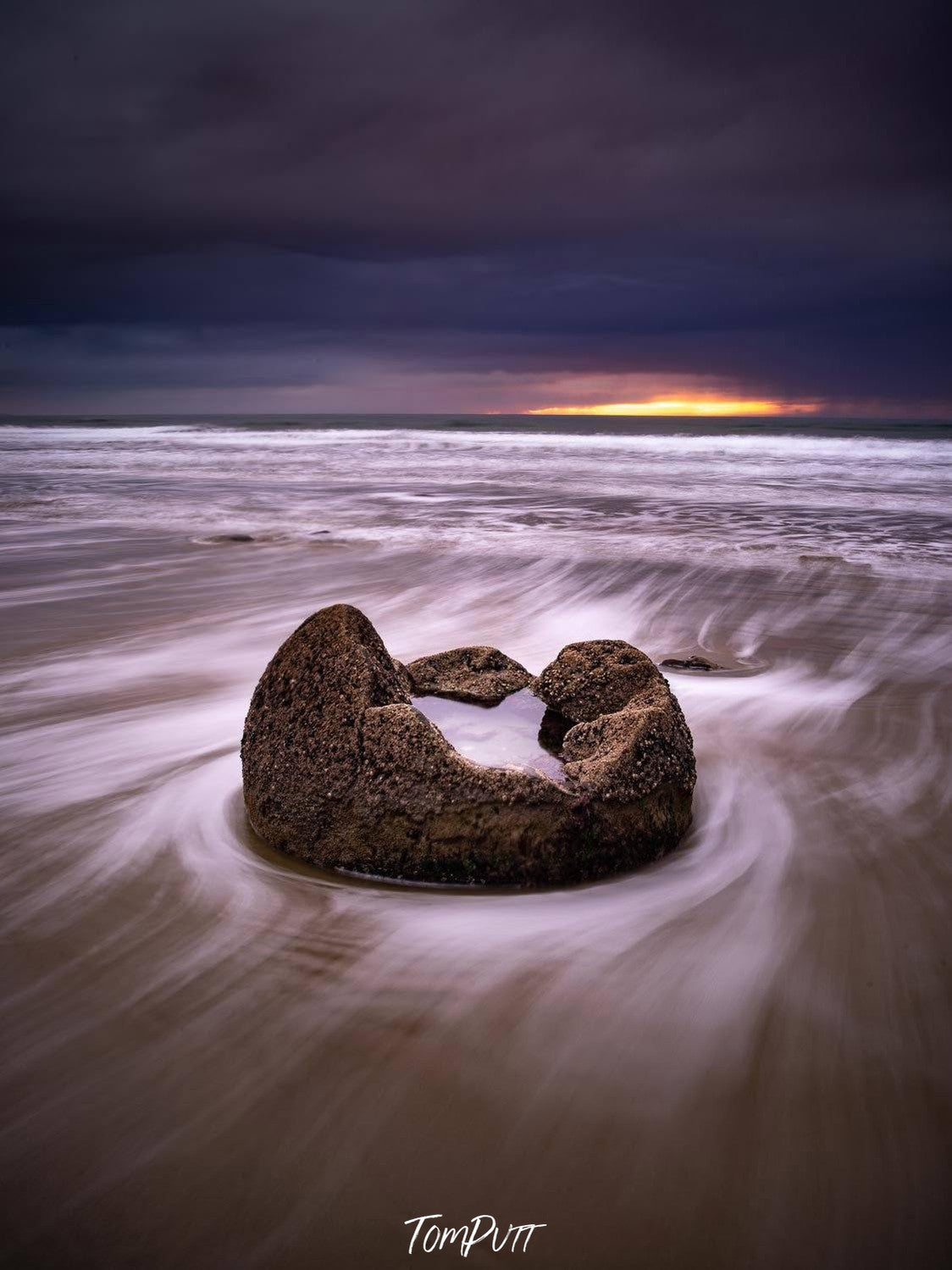 A steady flow of water and a sofa formed naturally by stones, Moeraki Eggshell - New Zealand