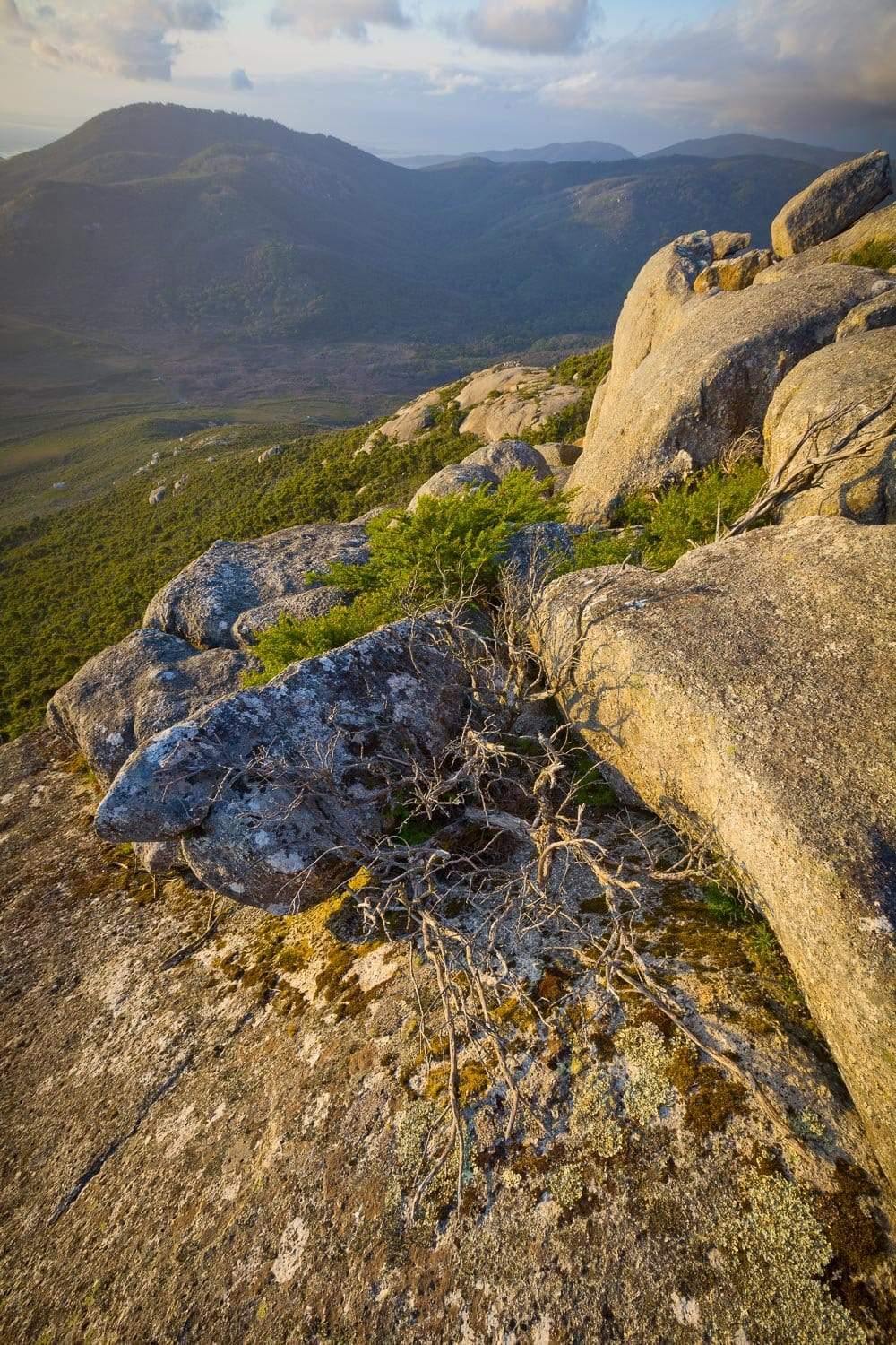 Stones on a hill area with a lot of grass below, Mount Oberon - Wilson's Promontory VIC