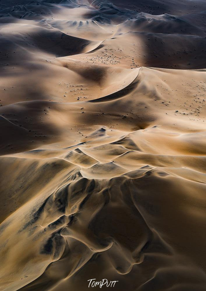Aerial view of a desert with huge waves of sand, Neverending
