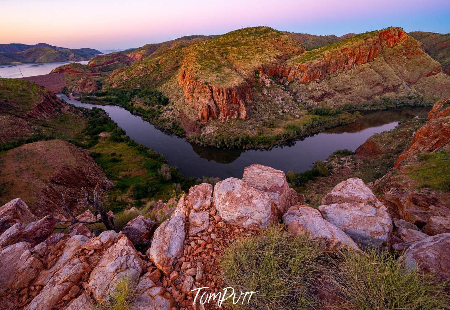 Large green and stony mountain walls with a small water course below, Ord River Bend, The Kimberley, Western Australia