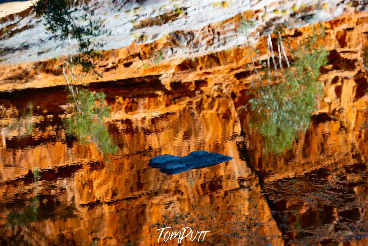 Yellowish shiny mountain wall with some snow over the edge, Ormiston Gorge Reflections, West MacDonnell Ranges - Northern Territory