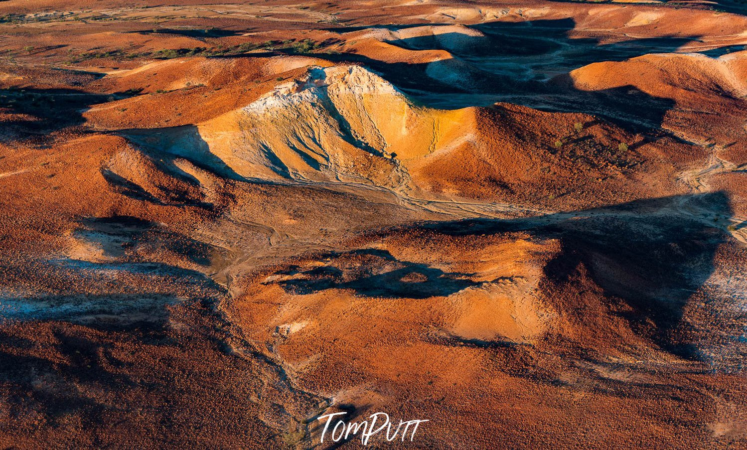 Aerial view of large golden mountains on desert land with sunlight fall, Painted Hills #17