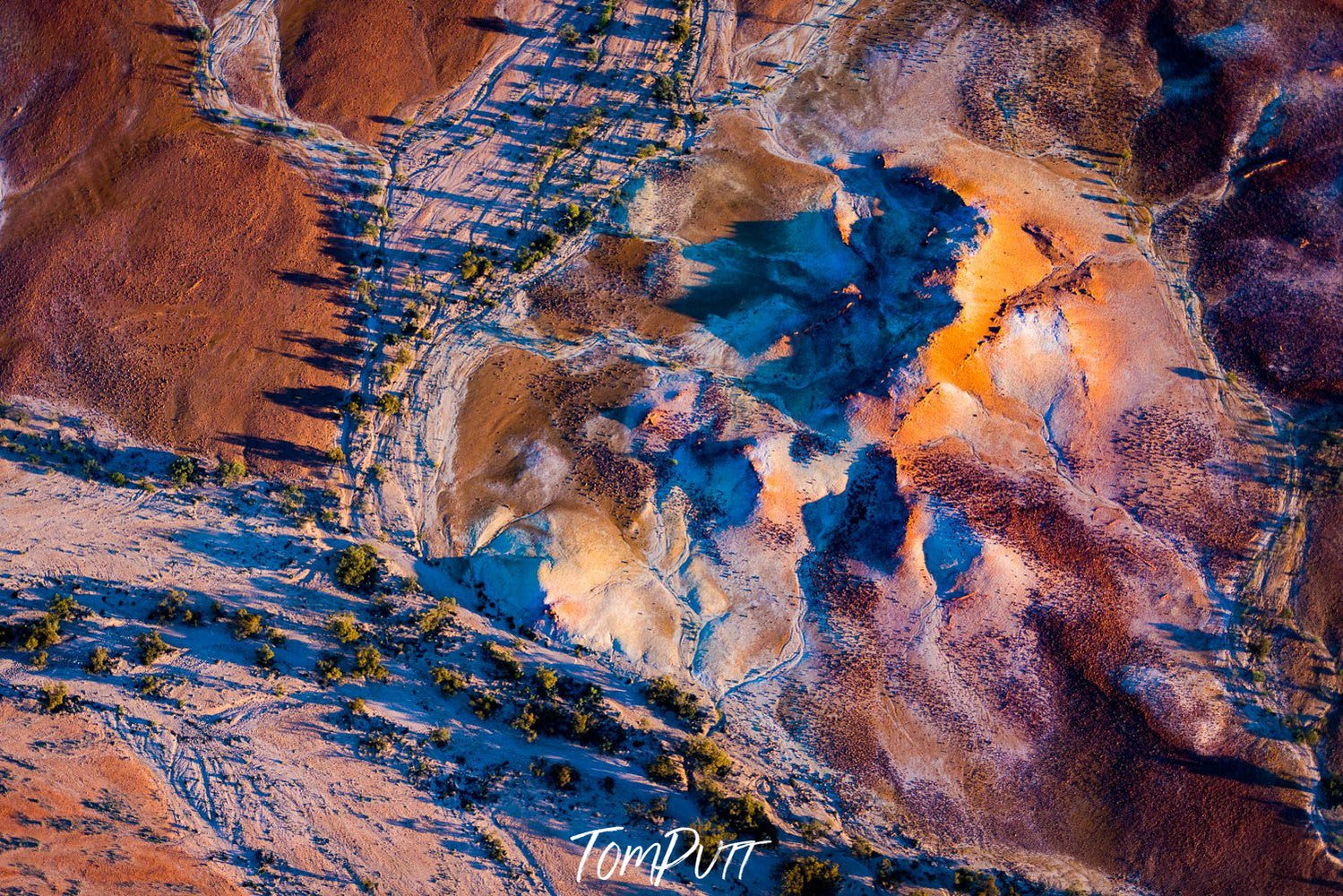 Aerial view of a painted snow mountains texture on a desert-like surface, Painted Hills #23