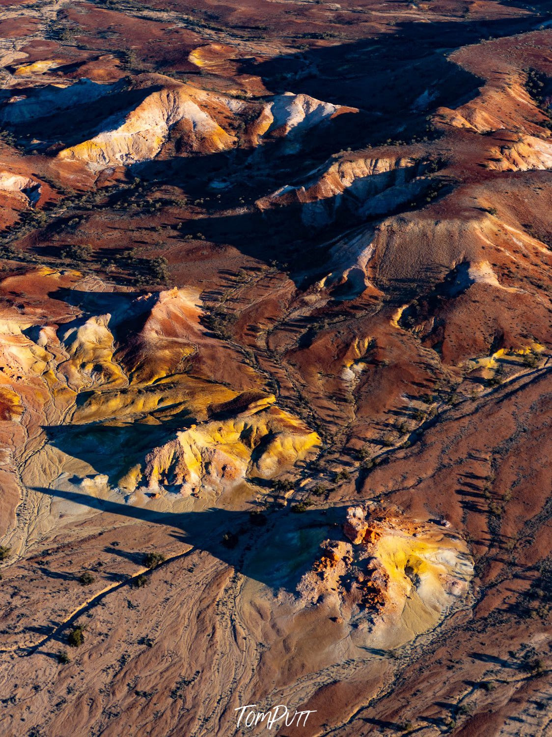 Aerial view of dark brown mountains on desert-like surface, Painted Hills #29