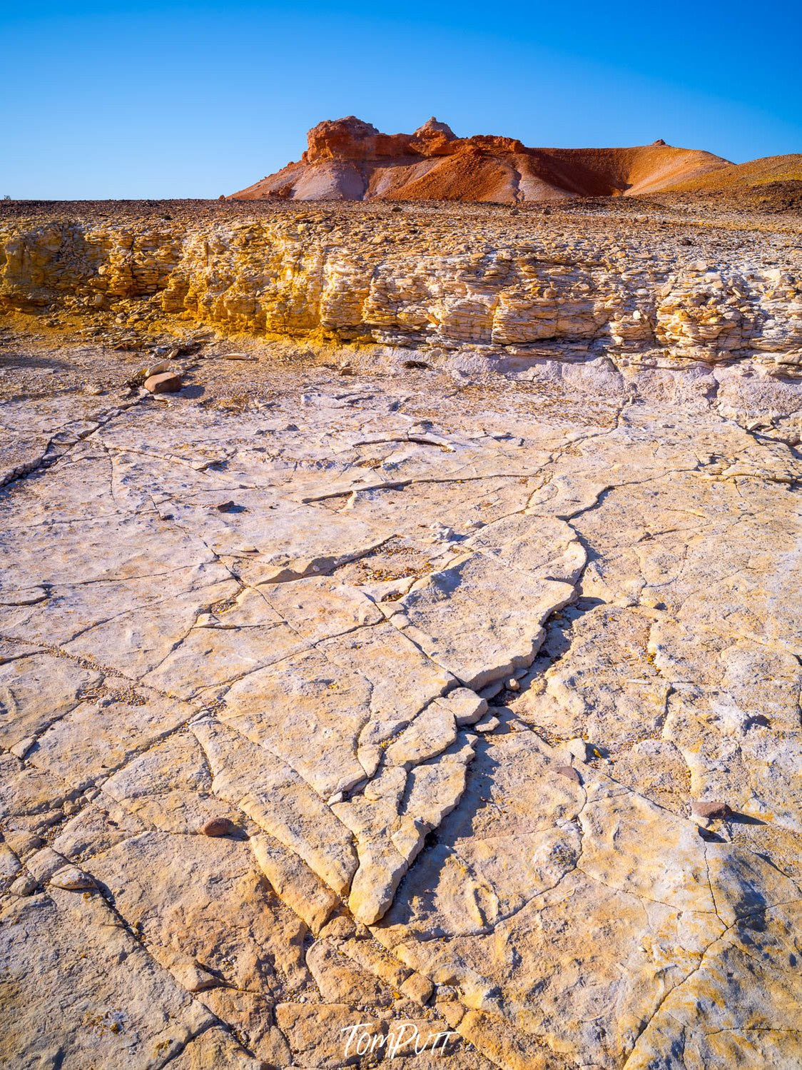 A cracky surface following a mountain wall with a high mound, Painted Hills #32