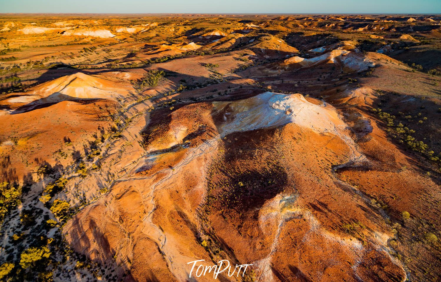 Aerial view of the land of golden mounds with the shiny effect of sunlight, Painted Hills #4