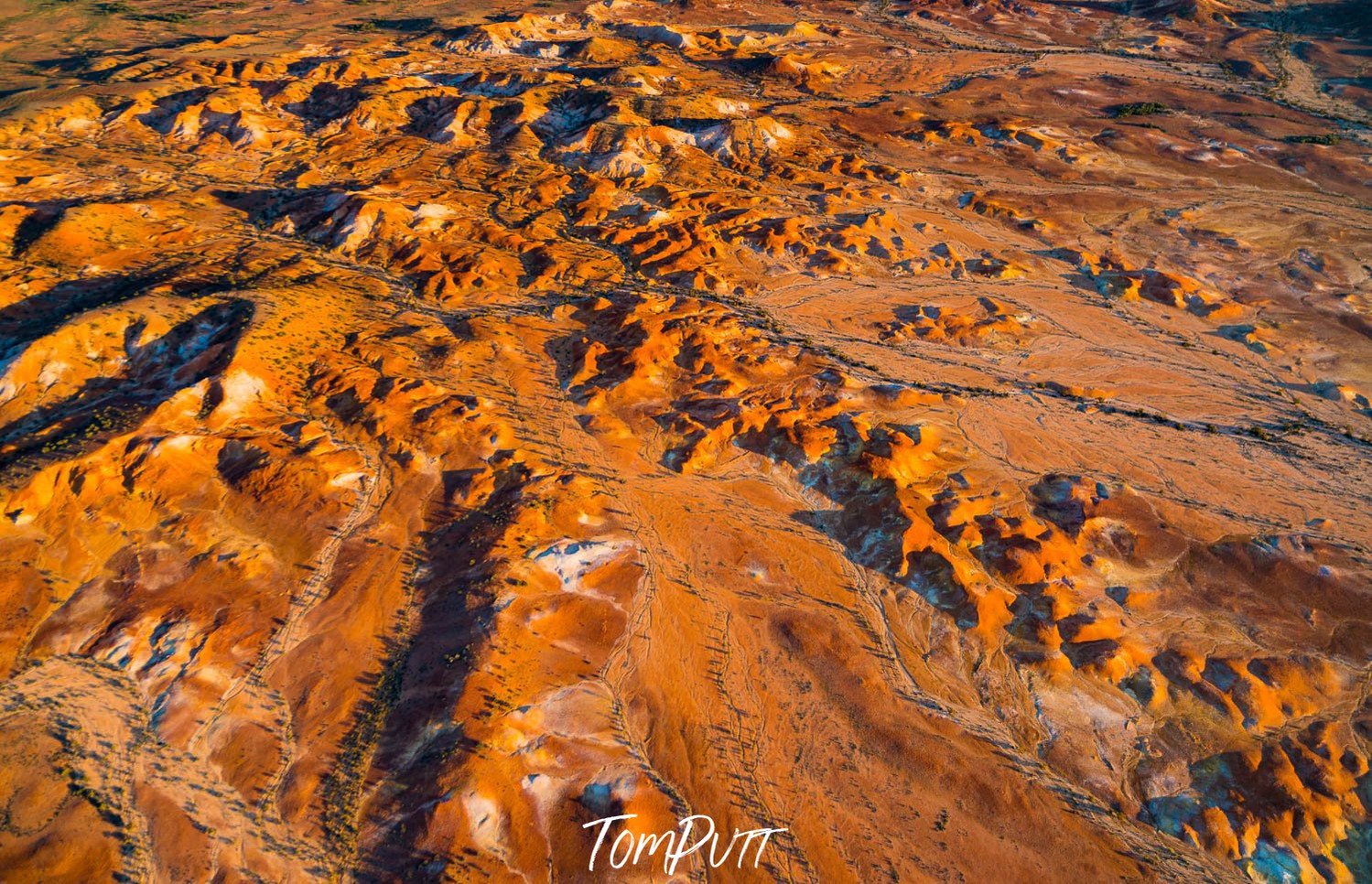 Aerial view of the land of shining mountain walls with the shiny effect of sunlight, Painted Hills #5