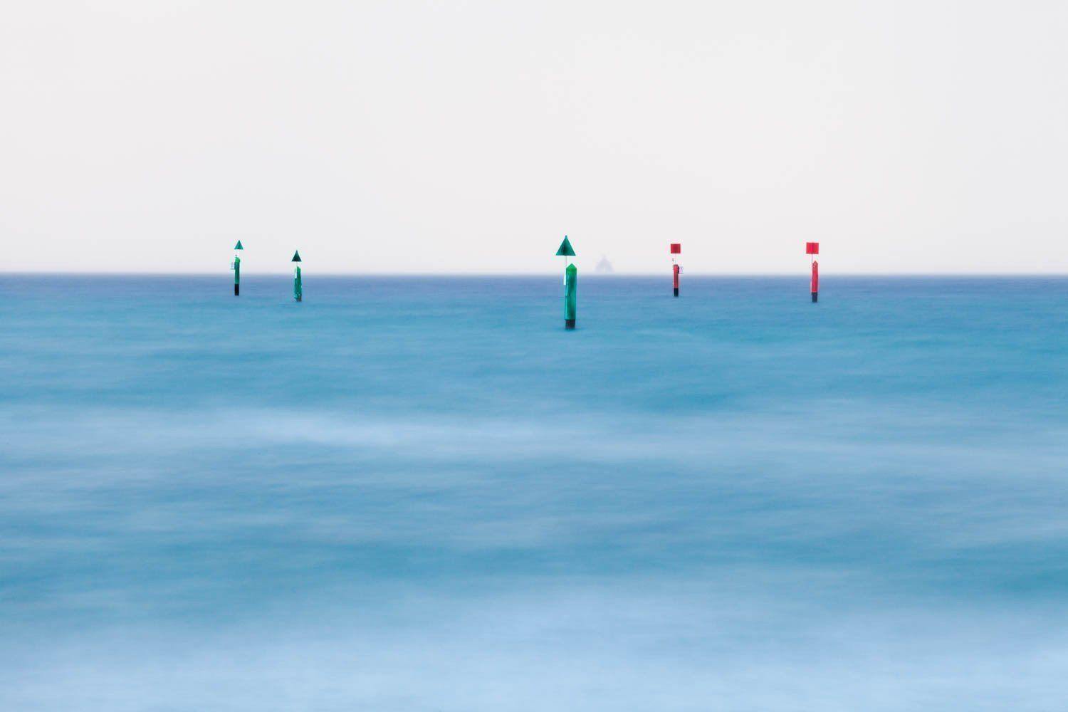 Colorful poles standing in a center of an ocean, Poles, Rye - Mornington Peninsula VIC