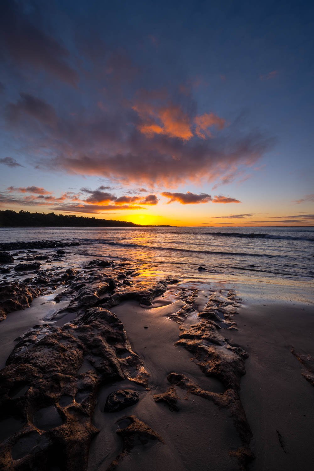 Beach with stony surface and the sunset behind, Shoreham Foreshore - Mornington Peninsula VIC