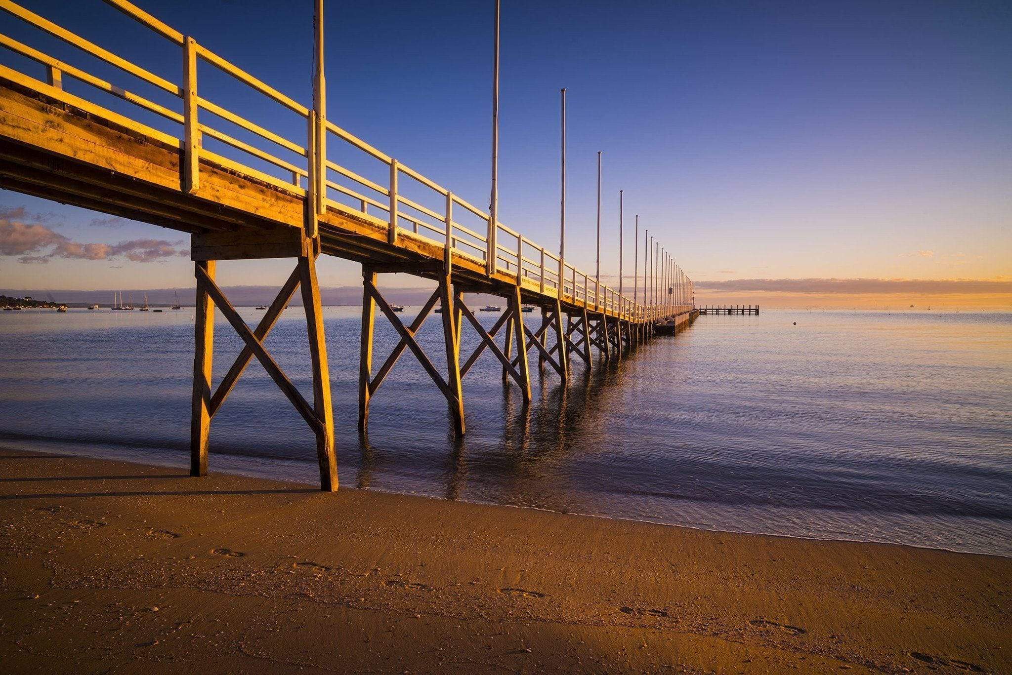 A long bridge over the lake with the pillar underwater, Sorrento Couta Boat Club Jetty sunrise