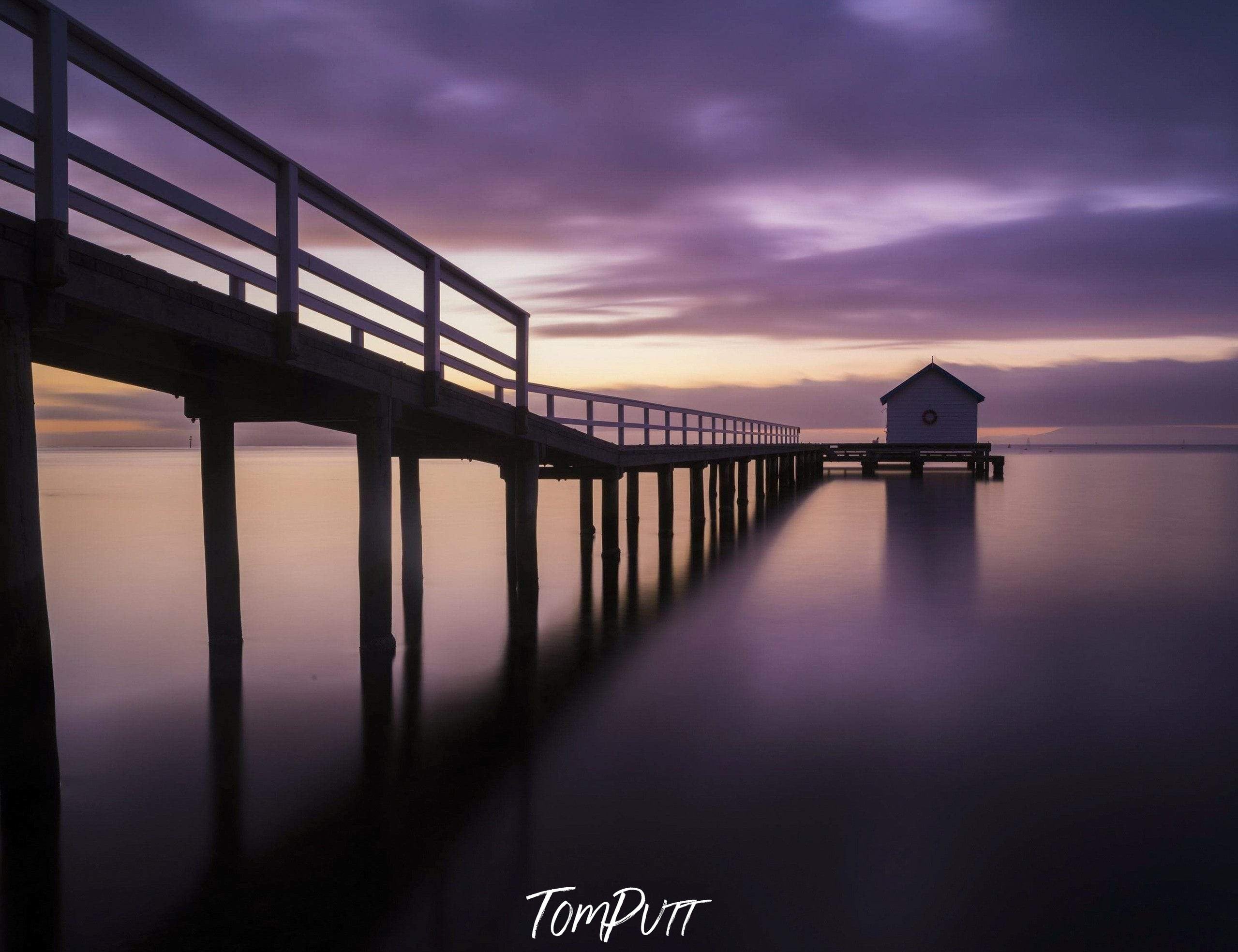 A long dark wooden bridge over the beach, Sorrento pier sunrise