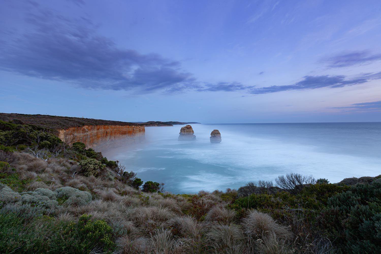 Long-shot of tow standing rocks at the sea shore, Two Apostles - Great Ocean Road VIC