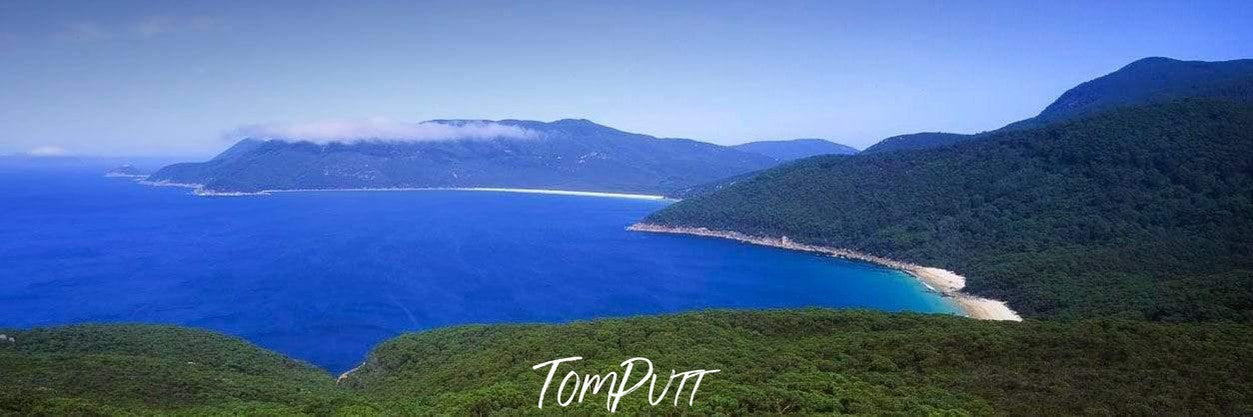 A large green mountain wall spread over a corner of the sea, Waterloo Bay - Wilson's Promontory VIC