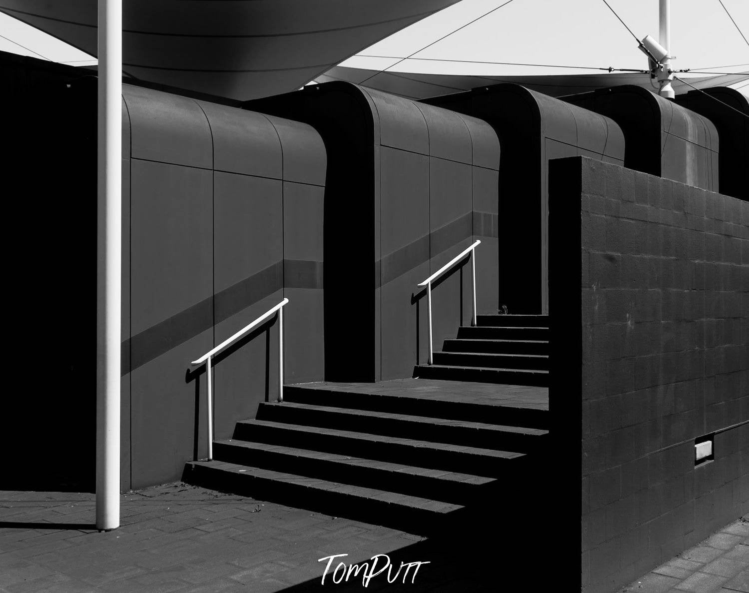 Beautiful inner view of the stairs of a dark-colored resort, Yulara Resort #2 - Red Centre NT