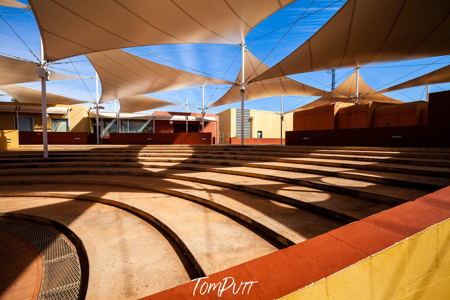 The beautiful inside architecture of a big lobby with lite rays of sunlight coming in, Yulara Resort #5 - Red Centre NT
