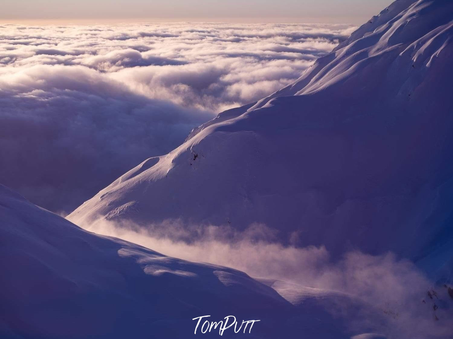 Clouds moving through gap in mountains in New Zealand