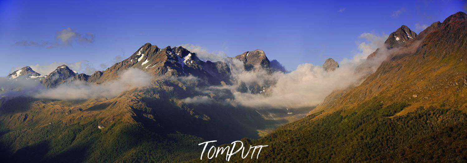 Giant Green Mountains Hills with some peak points into the clouds, Alisa Mountain, Routeburn Track - New Zealand