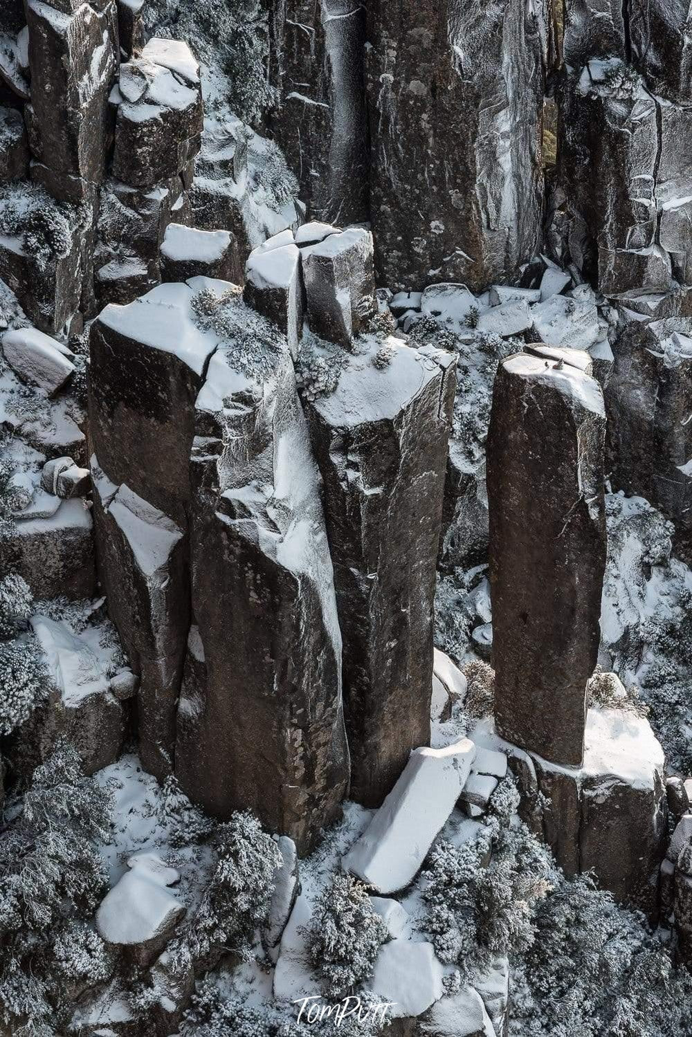 An undefined shape of standing pieces of giant stones penetrated in the ground, Amphitheatre Snowfall - MT Wellington