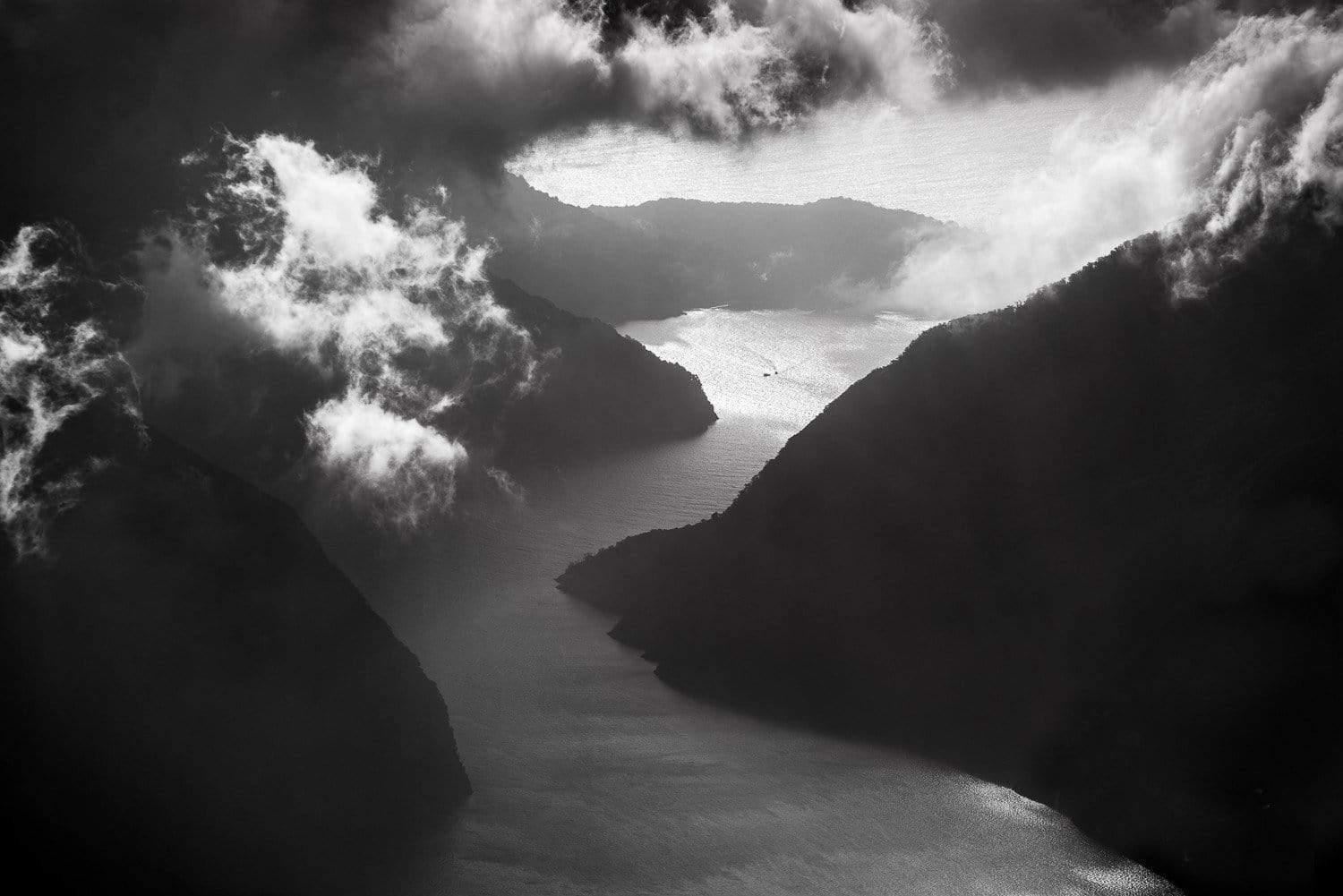 A dark view storm, smoky clouds interesting the giant black cliffs, Approaching Strom, Milford Sound
