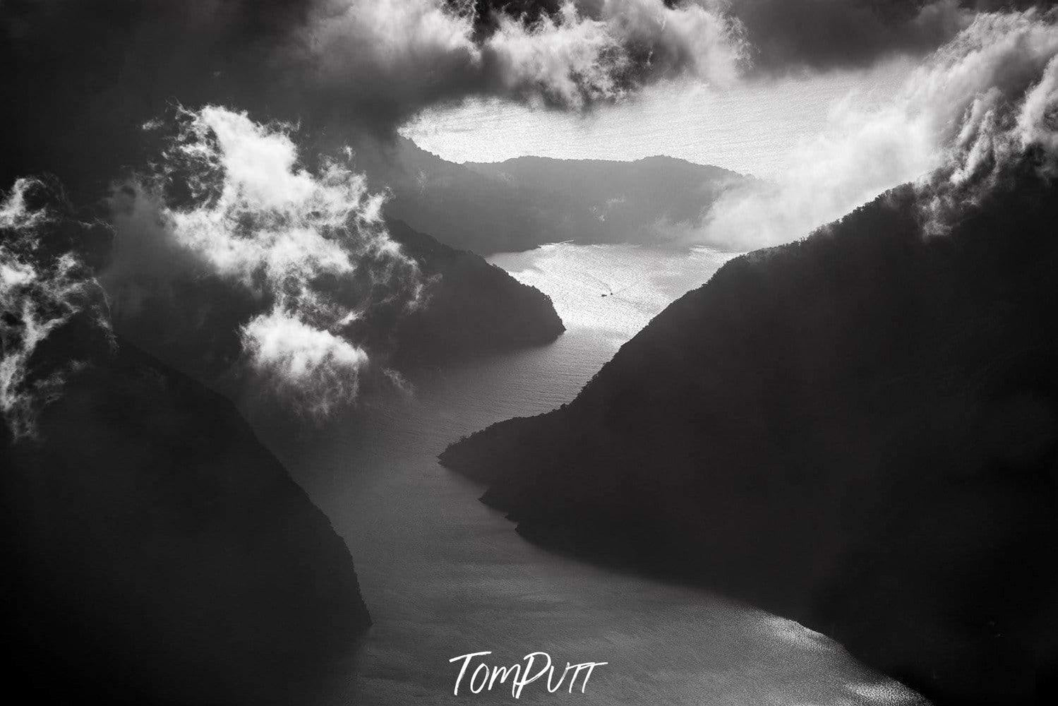 A dark view storm, smoky clouds interesting the giant black cliffs, Approaching Strom, Milford Sound