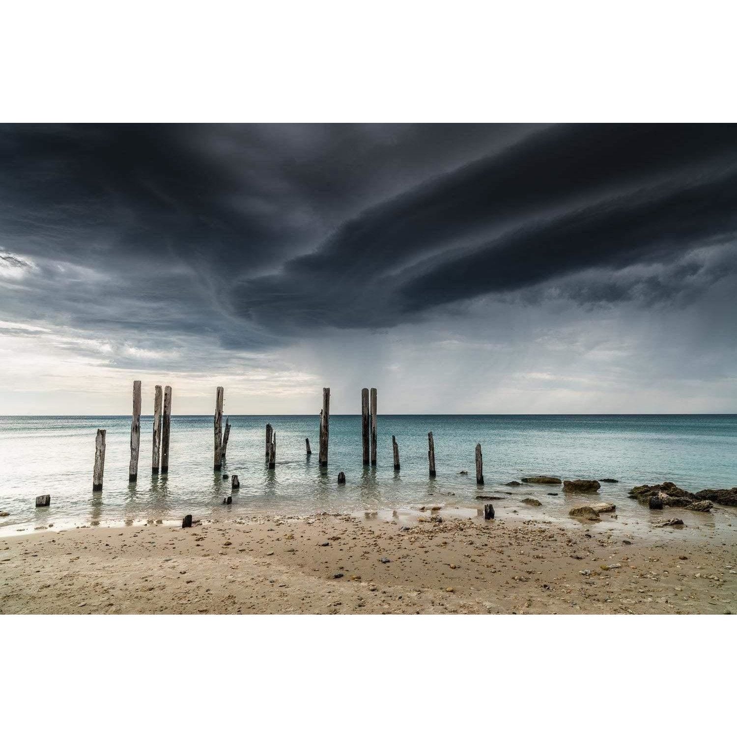 Wood pillars standing tall penetrating in the ground underwater, and the stormy black clouds are ready to fall, Armageddon, Willunga SA Artwork 