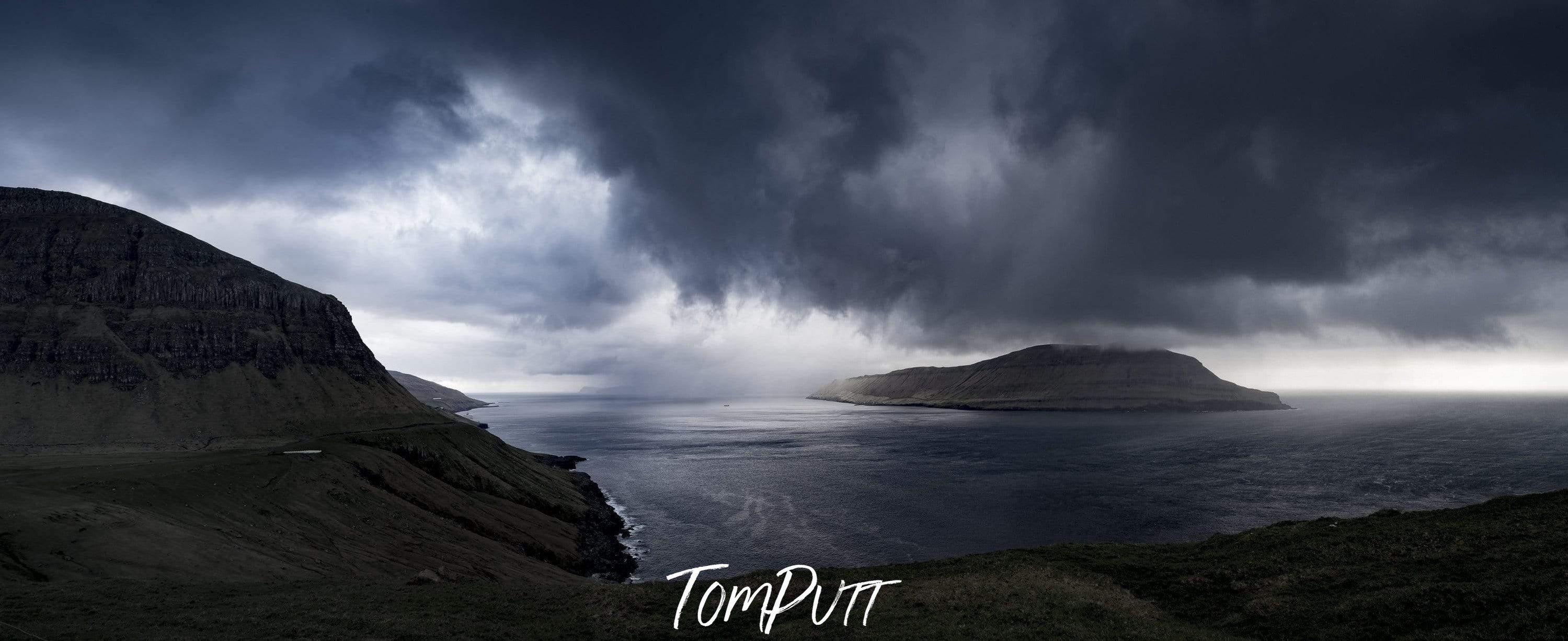 Giant black clouds are ready to fall heavily exactly on the mount of the Atlantic ocean, Atlantic Storm, Faroe Islands