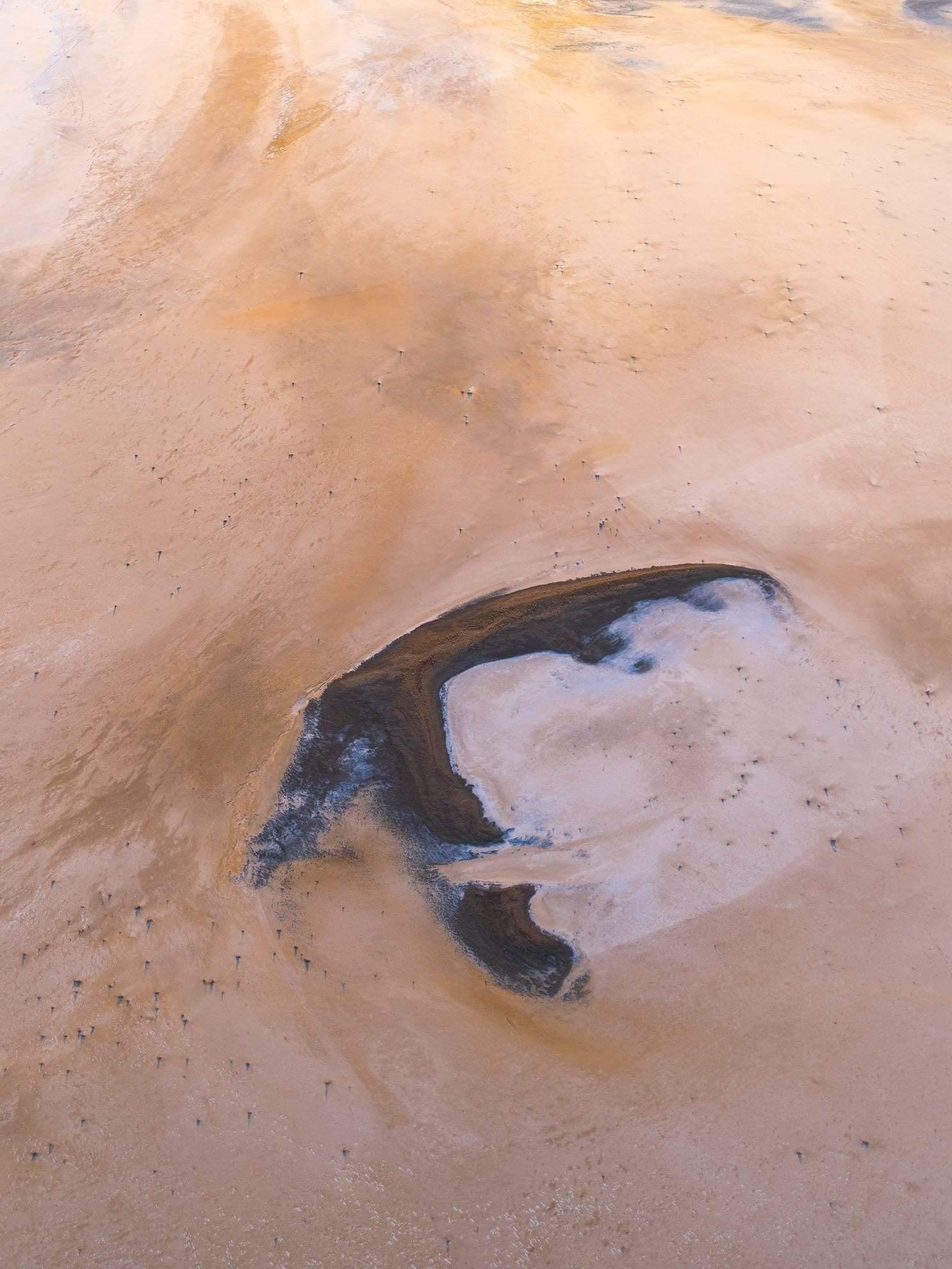 Large desert-like land with chocolate and smoky-colored mound depicting like ice-cream, Boomerang