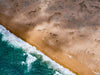 Aerial view of the green sea with bubbling waves connecting with desert, and partially hitting sunlight corner, Broome #44