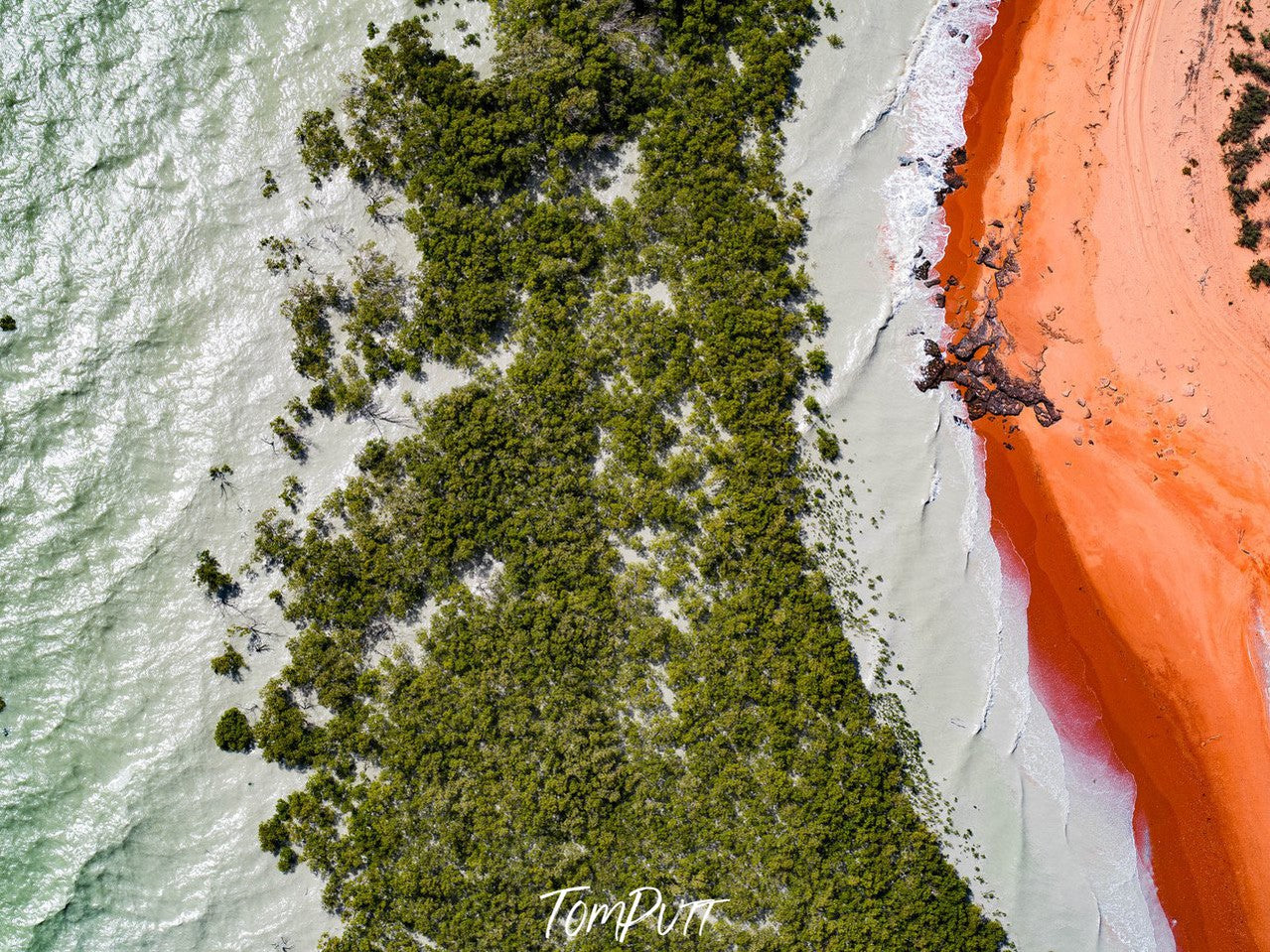 Aerial view of the forest having white wet sand, and an orange color land right corner, Broome No.57