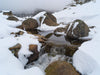Buffalo Stream-Tom-A dense snow-covered area with some rounded stones partially exposed, and a little water flow between the stones, Buffalo Stream - Victoria High Country-Landscape-Prints