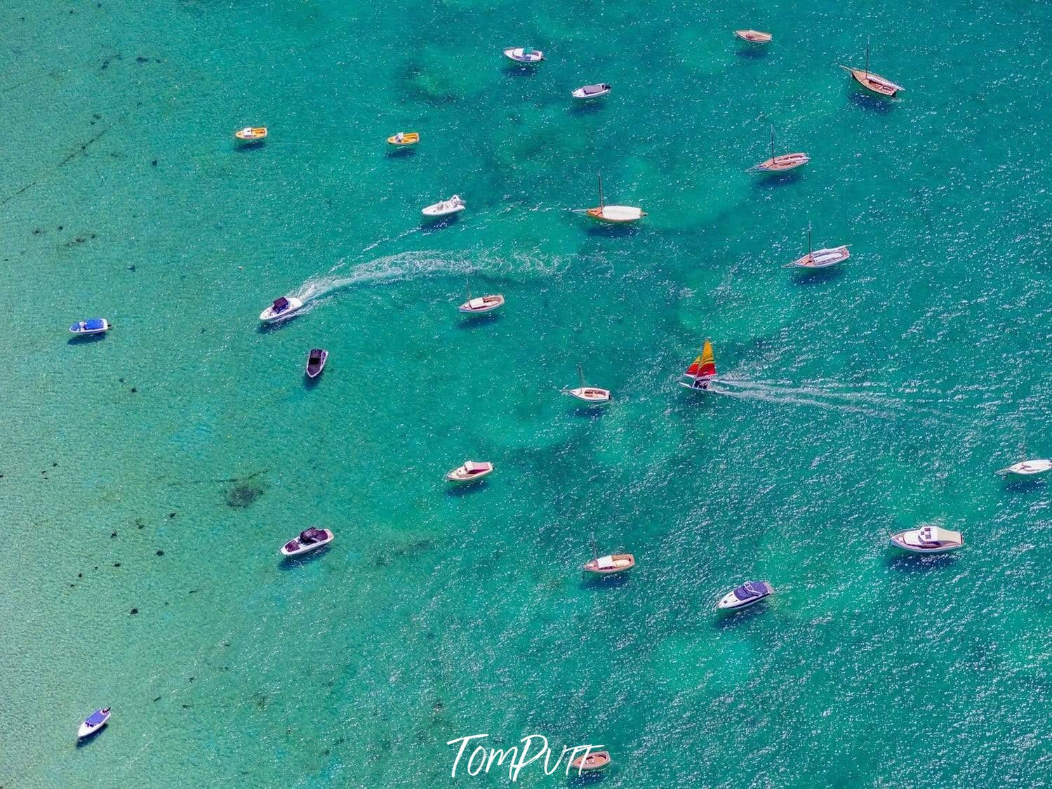 A beautiful deep-sea-green color ocean with a group of floating boats, Catamaran - Mornington Peninsula