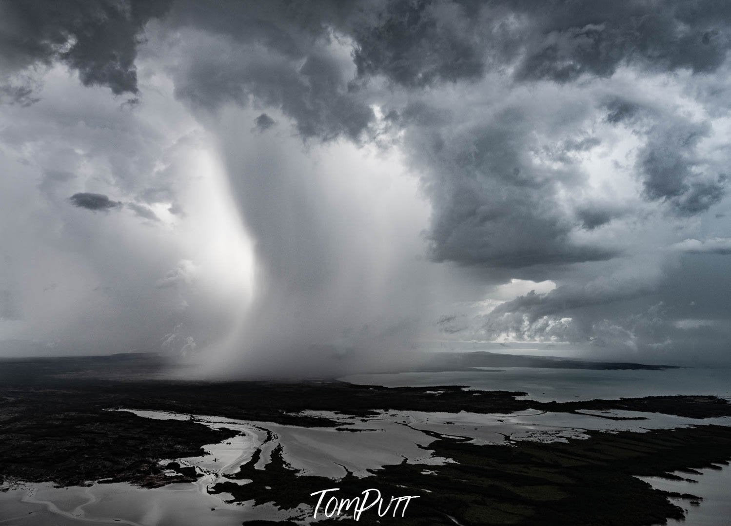 A horrifying view of the sea converging with the clouds and making a cloudy storm in a black and white portrait, Cloudburst, The Kimberley