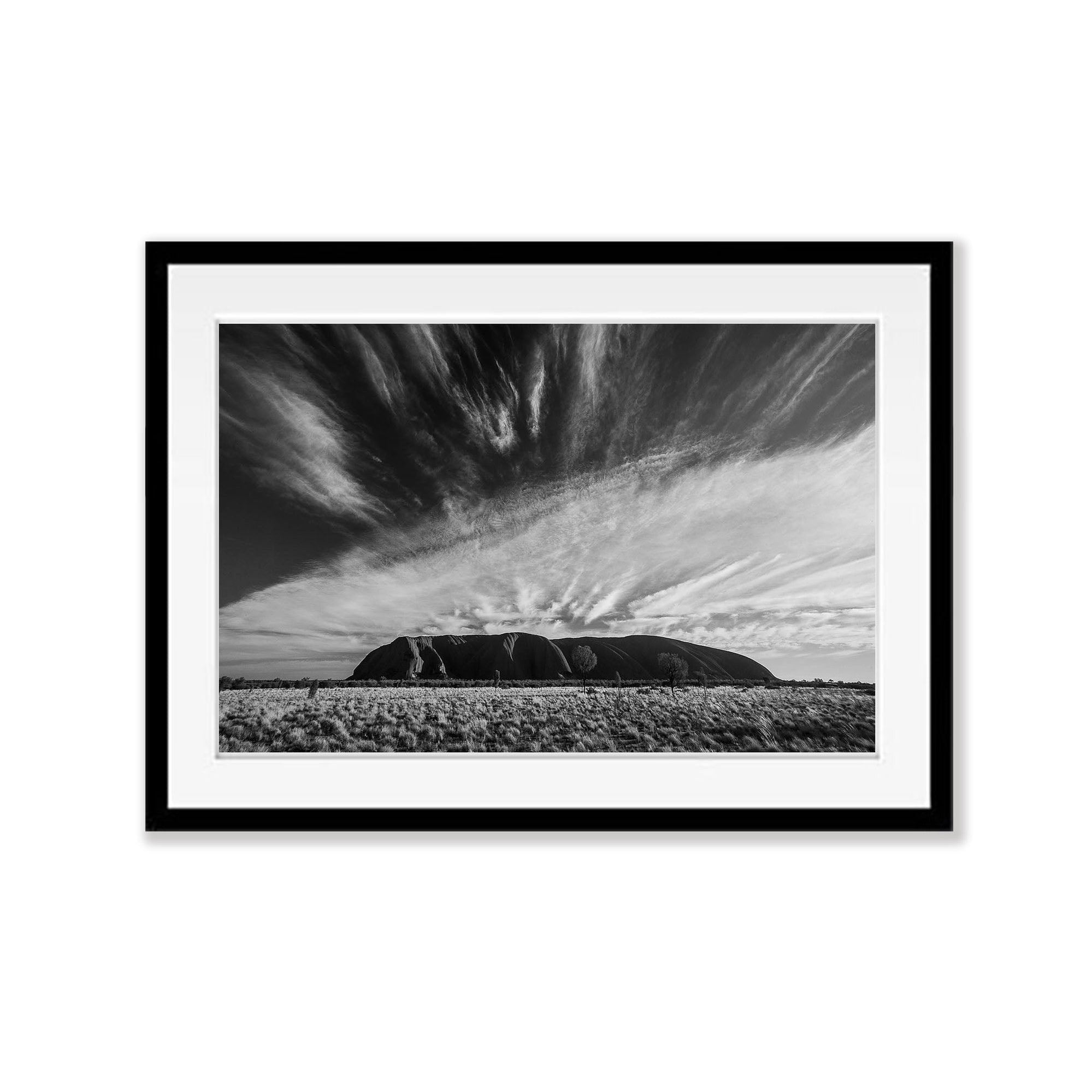 Clouds streaming over Uluru, Northern Territory