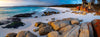 A beautiful landscape view of a seashore with white powder-like sand and some groups of random shaped stones are located in different areas, Cosy Corner Sunrise, Bay of Fires