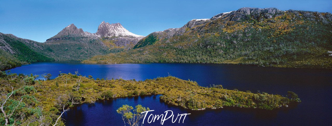 A clear lake surrounded with green mountain walls, and some grassy area in the water, Cradle Mountain #38, Tasmania